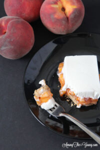 The best fall peach dessert featured by top Utah Lifestyle blog Among the Young: image of Peach delight with a bite
