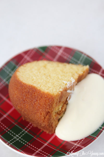 The Best Egg Nog Pound Cake featured by top Utah Foodie blog, Among the Young: image of cake with cream 