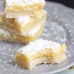 The Best Lemon Bars Recipe in the World, featured by top US food blog, Among the Young: image of lemon bars on a plate