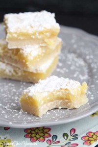 The Best Lemon Bars Recipe in the World, featured by top US food blog, Among the Young: image of lemon bars on a plate