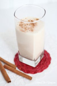 Easy Tres Leches Recipe by popular Utah lifestyle blog, Among the Young: Pinterest image of a glass of horchata. 