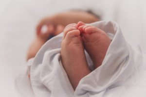 10 things to do in the hospital after baby featured by top Utah Lifestyle blog, Among the Young: image of baby feet