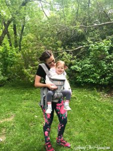 mom wears toddler in Ergo Baby carrier