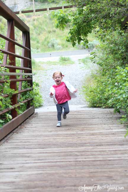 Hiking with an Ergo Baby Carrier featured by top US lifestyle blog, Among the Young: Hike with Ergo Baby baby on a bridge