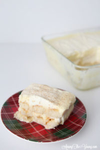 The Best Egg Nog Tiramisu featured by top Utah Foodie blog, Among the Young: image of white tiramisu slice with the pan