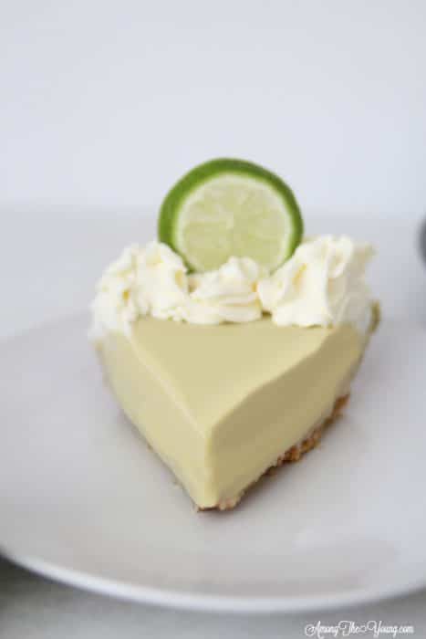 The Best Key Lime Pie featured by top Utah Foodie blog, Among the Young | Summer Dessert Ideas: Easy Key Lime Pie Recipe by popular Utah food blog, Among the Young: image of a Key Lime Pie.