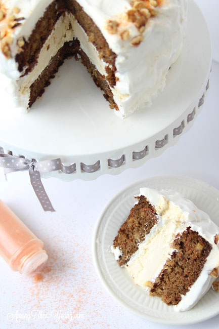 Carrot cake cheesecake cake featured by top Utah Foodie blog, Among the Young: image of Cake and slice of cake | The Ultimate Carrot Cake Cheesecake Cake Recipe by popular US food blog, Among the Youngs: image of carrot cake cheesecake. 