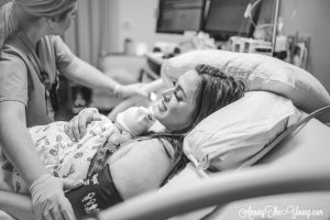 Baby girl birth story by top Utah lifestyle blog, Among the Young: image of mom getting checked after baby