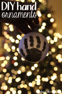 The cutest DIY handprint ornament featured by top Utah craft blog, Among the Young: image of dark ornament PIN