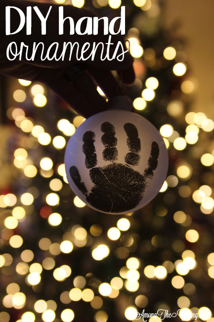 The cutest DIY handprint ornament featured by top Utah craft blog, Among the Young: image of dark ornament PIN | How to make the cutest DIY handprint ornament by popular Utah life and style blog, Among the Young: image of a DIY handprint ornament.