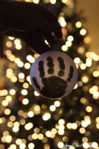 The cutest DIY handprint ornament featured by top Utah craft blog, Among the Young: image of dark ornament
