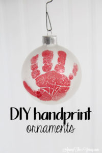 The cutest DIY handprint ornament featured by top Utah craft blog, Among the Young: image of red hand PIN