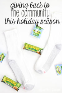 How to give back to the community this Christmas season featured by top Utah lifestyle blog, Among the Young: image of socks and granola bar PIN
