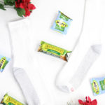 How to give back to the community this Christmas season featured by top Utah lifestyle blog, Among the Young: image of poinsettias and socks
