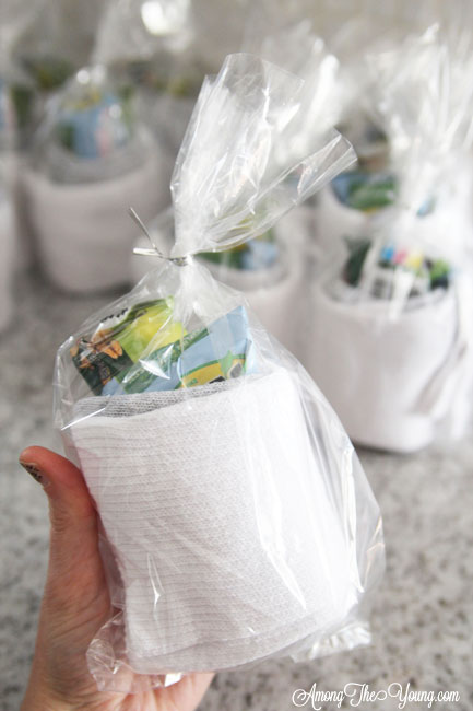 How to give back to the community this Christmas season featured by top Utah lifestyle blog, Among the Young: image of socks rolled up with a granola bar |Give Back by popular Utah lifestyle blog, Among the Young: image of rolled up socks with a granola bar and fruit snacks. 