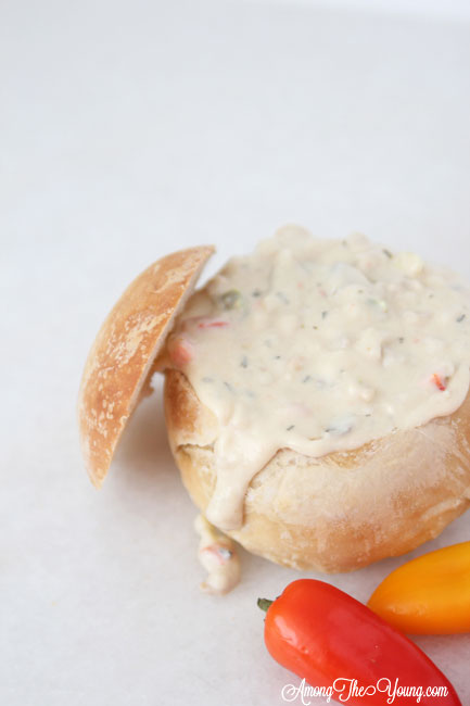 The best Disneyland Clam chowder featured by top Utah Foodie blog, Among the Young: image of clam chowder in a bread bowl | Copycat Recipes: Disneyland Clam Chowder Recipe by popular Utah food blog, Among the Young: image of copycat Disneyland clam chowder in a bread bowl. 
