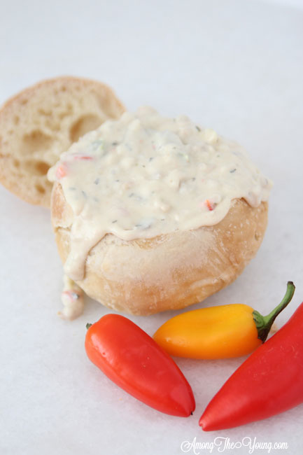 The best Disneyland Clam chowder featured by top Utah Foodie blog, Among the Young: image of clam chowder with peppers | Copycat Recipes: Disneyland Clam Chowder Recipe by popular Utah food blog, Among the Young: image of copycat Disneyland clam chowder in a bread bowl. 