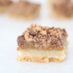 The Best Almond Roca Cookie bars featured by top Utah Foodie blog, Among the Young: image of Almond Roca Cookie bar in focus