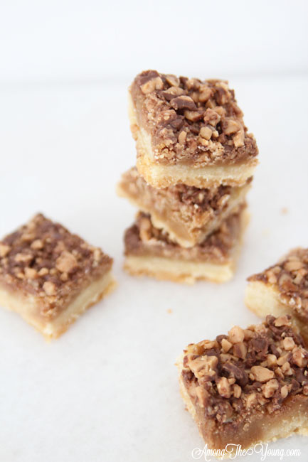 The Best Almond Roca Cookie bars featured by top Utah Foodie blog, Among the Young: image Almond Roca Cookie bars from above and around | Almond Roca by popular Utah lifestyle blog, Among the Young: image of Almond Roca cookie bars. 