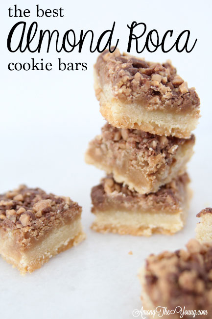 The Best Almond Roca Cookie bars featured by top Utah Foodie blog, Among the Young: image of Almond Roca Cookie bars stacked up high | Almond Roca by popular Utah lifestyle blog, Among the Young: image of Almond Roca cookie bars. 