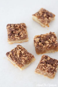 The Best Almond Roca Cookie bars featured by top Utah Foodie blog, Among the Young: image of Almond Roca Cookie bars spread out