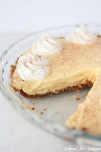 The Best Egg Nog Pie recipe featured by top Utah Foodie blog, Among the Young: image of Egg Nog Pie with Slice left out
