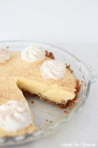 The Best Egg Nog Pie recipe featured by top Utah Foodie blog, Among the Young: image of Egg Nog Pie with a piece out