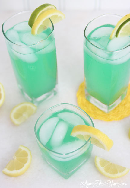 alt="The best Disneyland Mint Julep copycat recipe featured by top Utah Foodie blog, Among the Young: image of mint juleps from above with lemon and ice | Disneyland Mint Julep Recipe by popular Utah food blog, Among the Young: image of a Disneyland mint julep. 