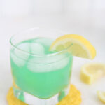 alt="The best Disneyland Mint Julep copycat recipe featured by top Utah Foodie blog, Among the Young: image of one mint julep with a lemon