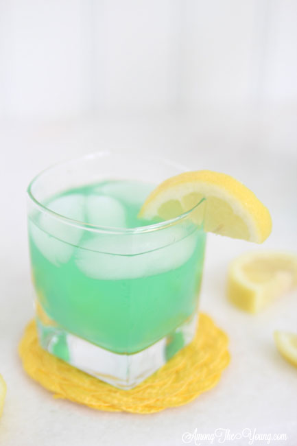 alt="The best Disneyland Mint Julep copycat recipe featured by top Utah Foodie blog, Among the Young: image of one mint julep with a lemon | Disneyland Mint Julep Recipe by popular Utah food blog, Among the Young: image of a Disneyland mint julep. 