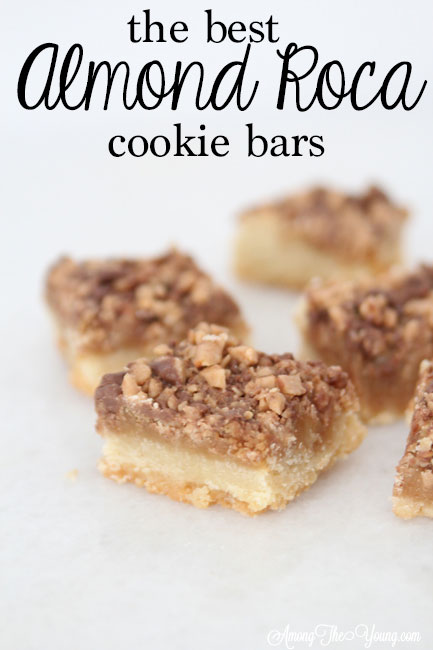 The Best Almond Roca Cookie bars featured by top Utah Foodie blog, Among the Young: image the Best Almond Roca Cookie Bar PIN | Almond Roca by popular Utah lifestyle blog, Among the Young: image of Almond Roca cookie bars. 