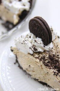 The Best easy Peanut Butter Pie recipe by top Utah Foodie blog, Among the Young: image of pie with more pie in the backgroud