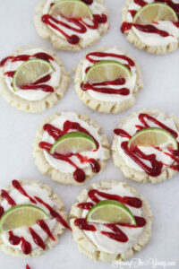 The most amazing raspberry lime sugar cookies featured by top Utah Foodie blog Among the Young: image of cookies scattered