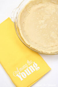 vodka pie crust recipe by top Utah Foodie Among the Young: image of pie with yellow napkin ATY