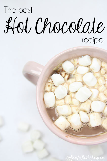 Hot chocolate recipe by top Utah Foodie Among the Young: image of super close hot cocoa |Hot Chocolate Recipe by popular Utah lifestyle blog, Among the Young: Pinterest image of mugs of hot chocolate. 