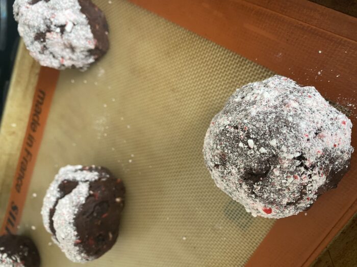 The dark chocolate peppermint cookies recipe featured by top Utah Foodie Among the Young: image of cookies on a tray |Chocolate Peppermint Cookies by popular Utah lifestyle blog, Among the Young: image of chocolate peppermint cookies on a Silpat baking mat.  