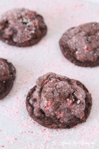 The dark chocolate peppermint cookies recipe featured by top Utah Foodie Among the Young: image of cookies on mints