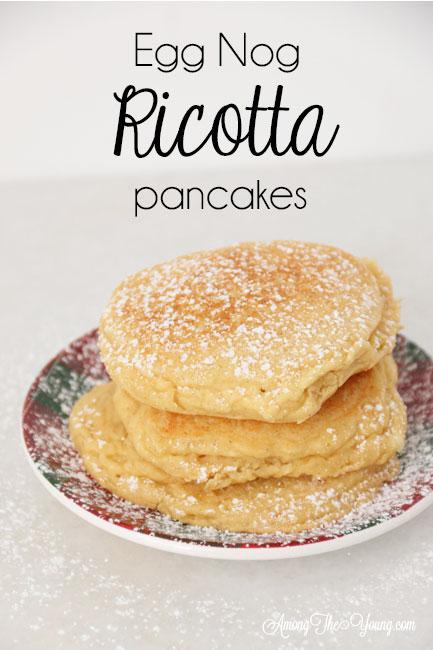 The best ricotta pancakes recipe featured by top Utah Foodie Among the Young: image of ricotta pancakes stacked pin |Ricotta Pancakes by popular Utah lifestyle blog, Among the Young: Pinterest image of egg nog ricotta pancakes. 