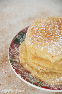 The best ricotta pancakes recipe featured by top Utah Foodie Among the Young: image of pancakes and nutmeg
