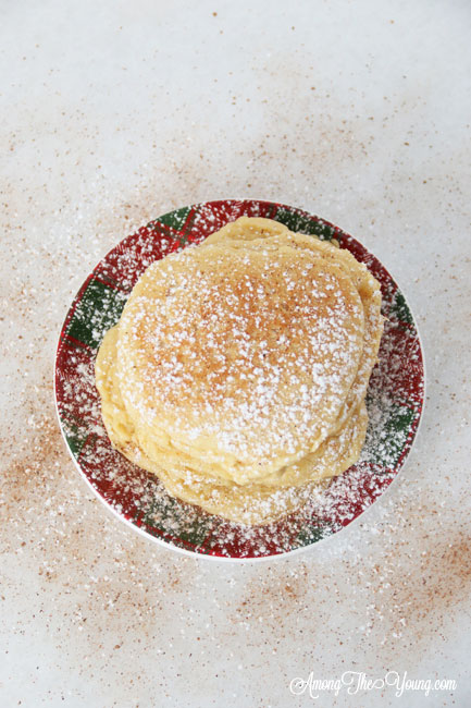 The best ricotta pancakes recipe featured by top Utah Foodie Among the Young: image of pancakes from above |Ricotta Pancakes by popular Utah lifestyle blog, Among the Young: Pinterest image of egg nog ricotta pancakes. 