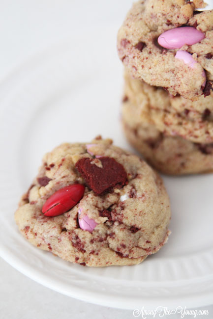 The Best Valentines browned butter cookies featured by top Utah Foodie blog Among the Young: close up image of a Red velvet oreo cookie |Browned Butter Cookies by popular Utah food blog, Among the Young: image of browned butter red velvet Oreo M&M cookies. 