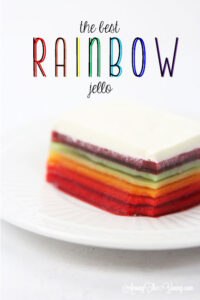 The best rainbow Jello featured by top Utah Foodie blog Among the Young: image of fresh slice PIN
