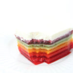 The best rainbow Jello featured by top Utah Foodie blog Among the Young: image of Jello with a bite taken out of it