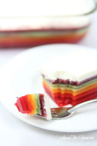 The best rainbow Jello featured by top Utah Foodie blog Among the Young: image of Jello bite in focus