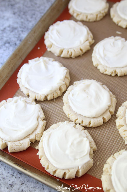 The most amazing raspberry lime sugar cookies featured by top Utah Foodie blog Among the Young: image of unfrosted cookies | Key Lime Raspberry Sugar Cookies by popular Utah food blog, Among the Young: image of key lime raspberry sugar cookies on a baking sheet.