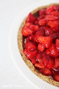 The best strawberry cream pie featured by top Utah Lifestyle blog Among the Young: image of strawberry cream pie side view