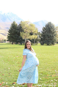 The best Non-Maternity dresses featured by top Utah fashion blog Among the Young: image of Clad and Cloth Ella blue floral dress fanned out