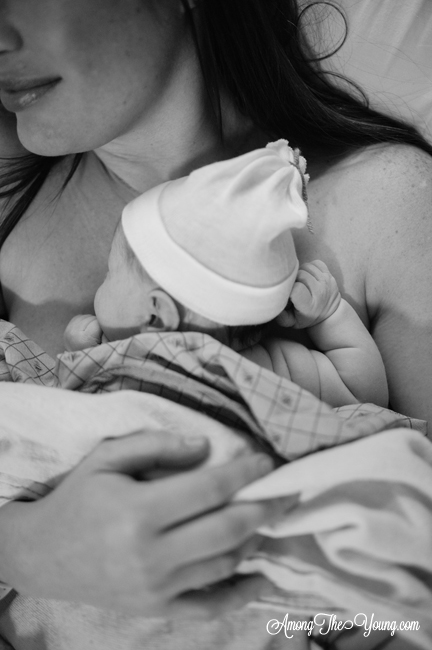 close up shot of mom holding newborn baby